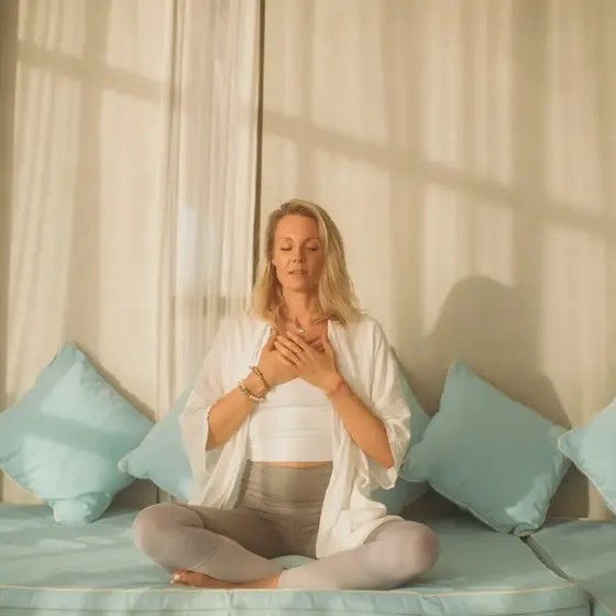 Graduate meditating in a peaceful space